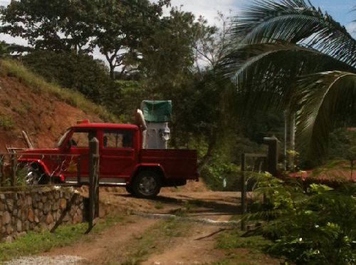 Refrigerator being delivered by taxicab in Costa Rica