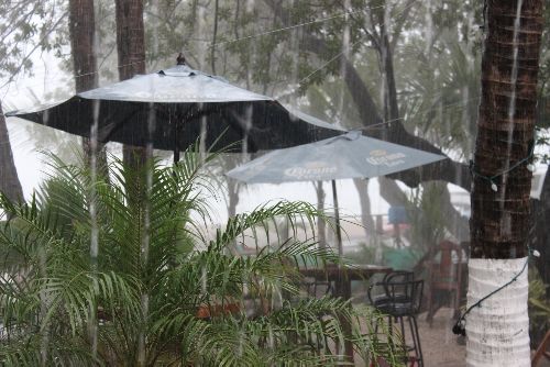 Costa Rica Rain on patio umbrellas